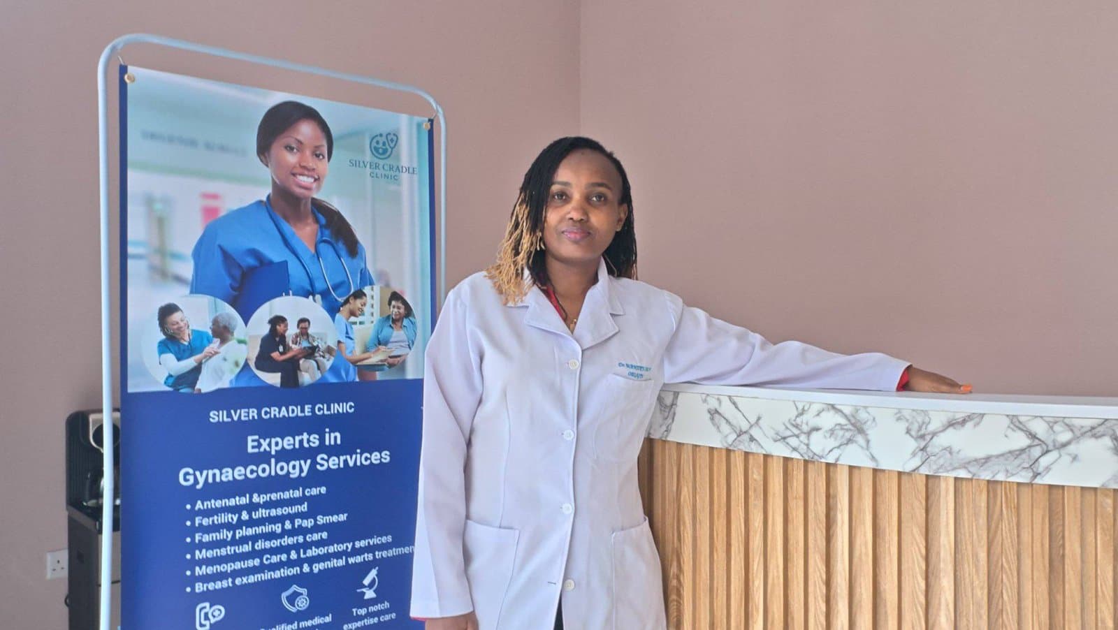 Dr Mary Wanjiku at the Silver Cradle Clinic reception desk